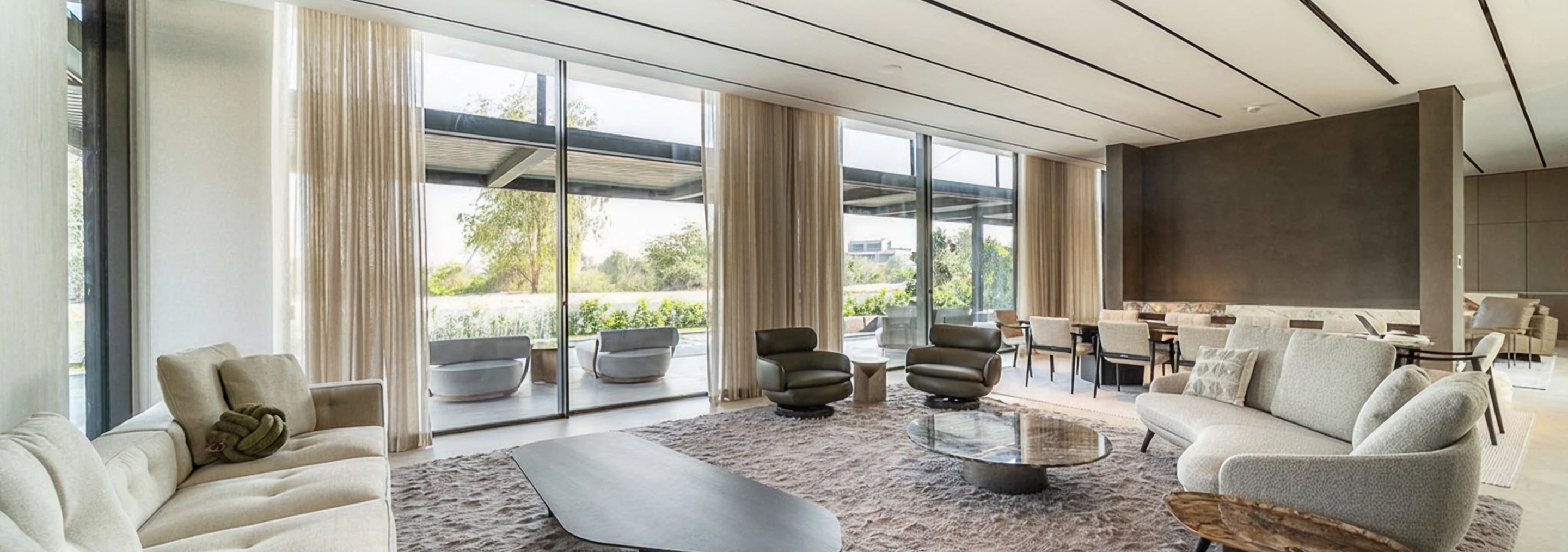 Modern villa design featuring expansive windows and custom aluminum facades