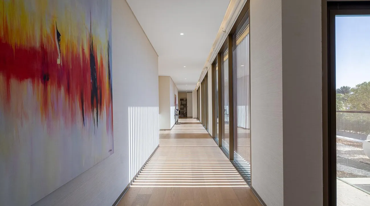 Luxury villa interior fit-out featuring light wood flooring and floor-to-ceiling windows in Palm Jumeirah.