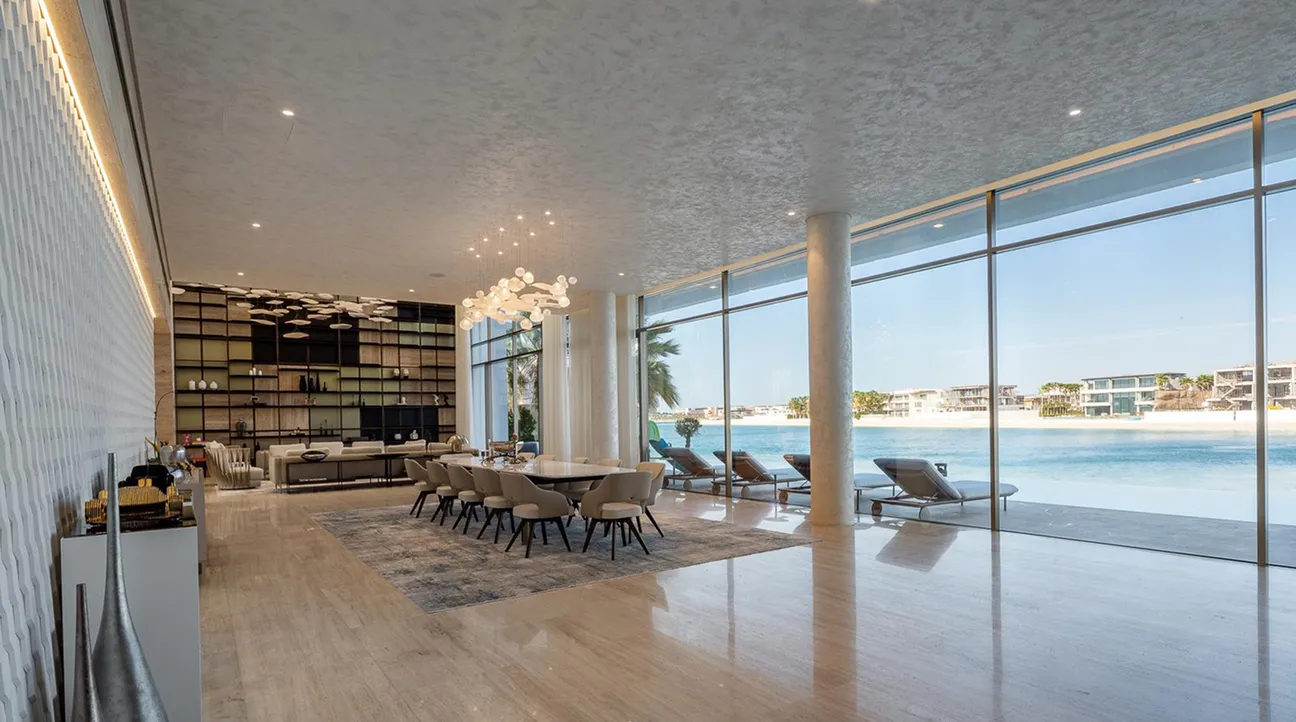 Spacious open-plan room interior fit-out featuring panoramic water views in a Palm Jumeirah villa.