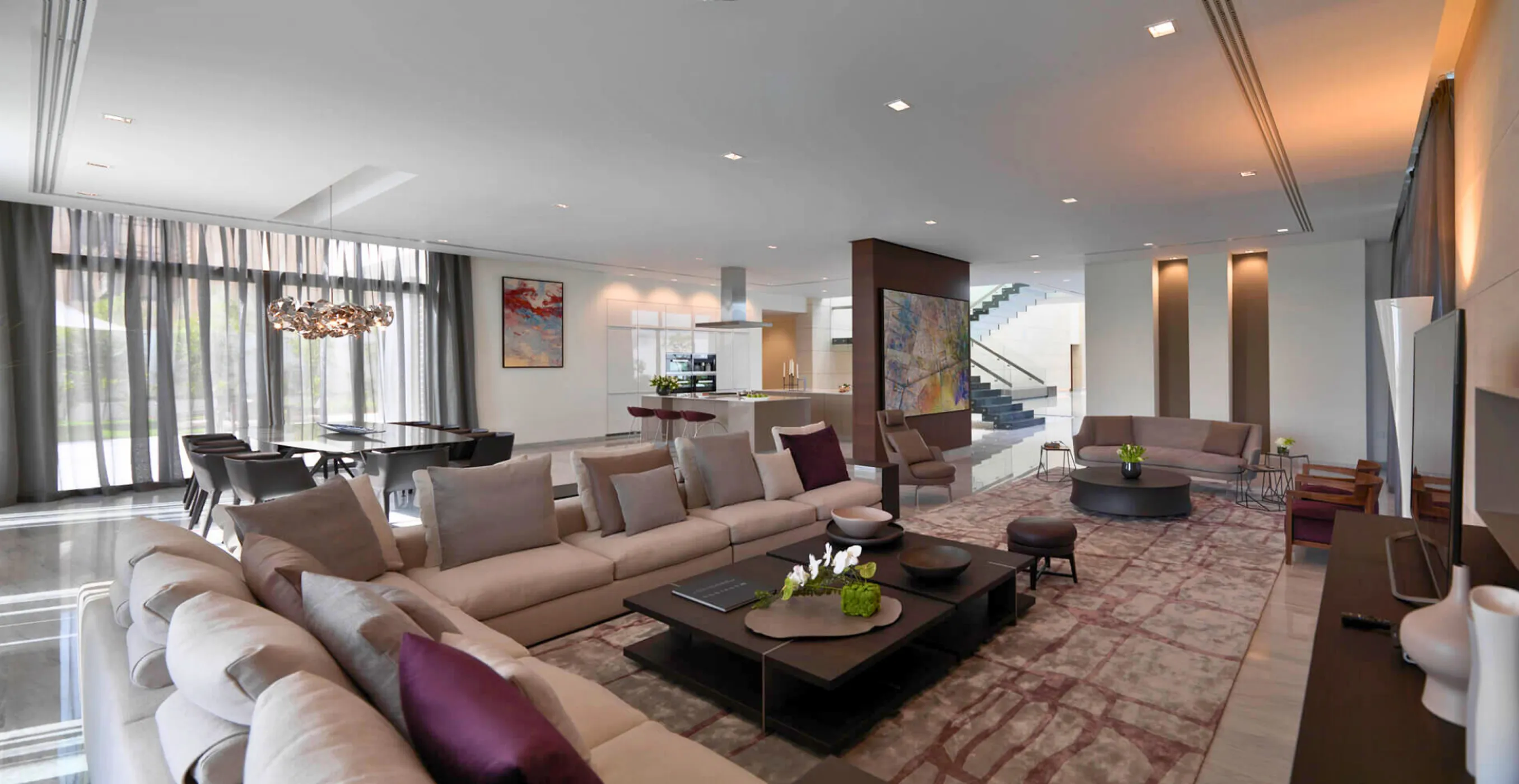Luxury open-plan fit-out with floor-to-ceiling windows and contemporary furnishings.
