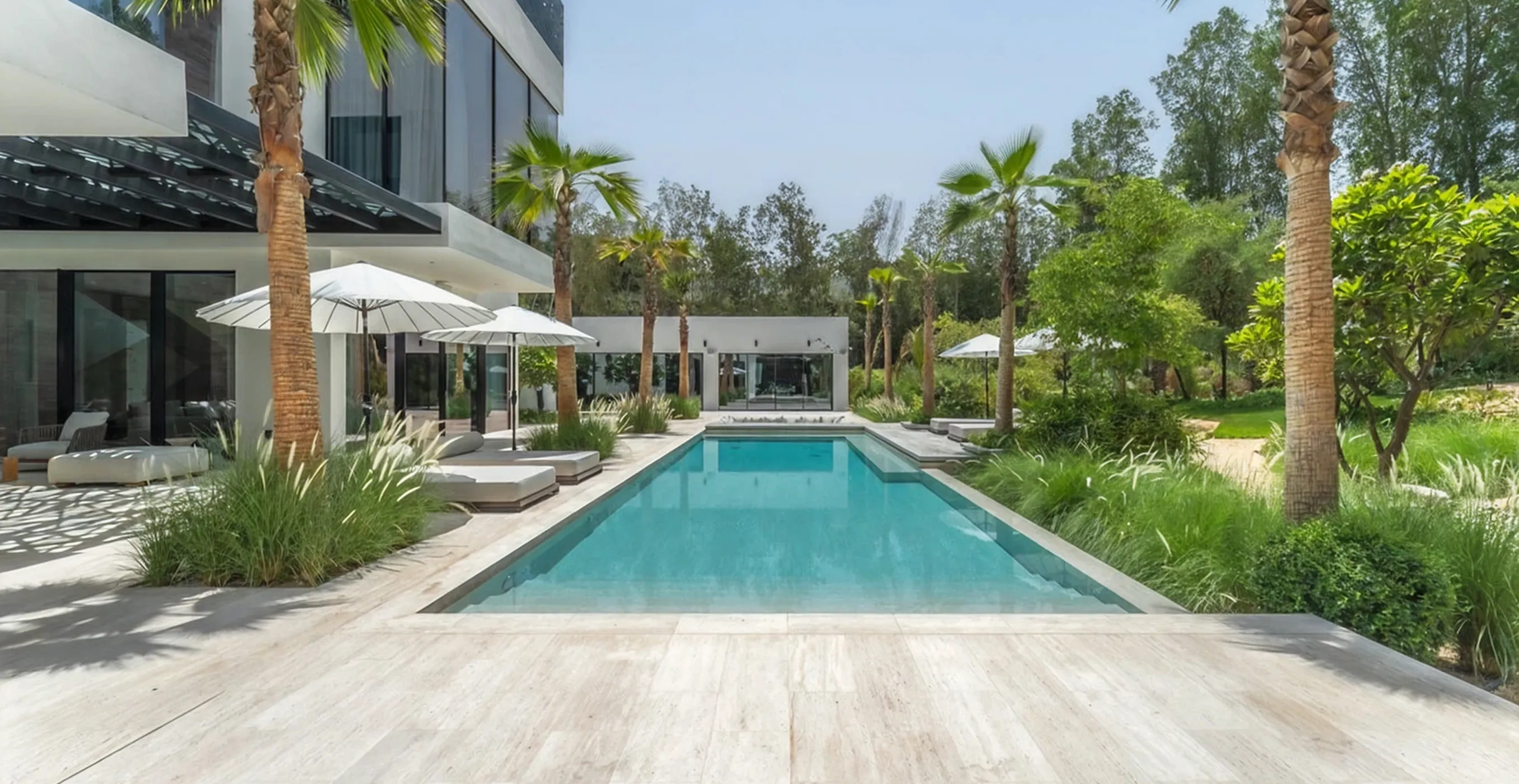 Modern villa with built-in infinity pool and lush greenery in Al Barari