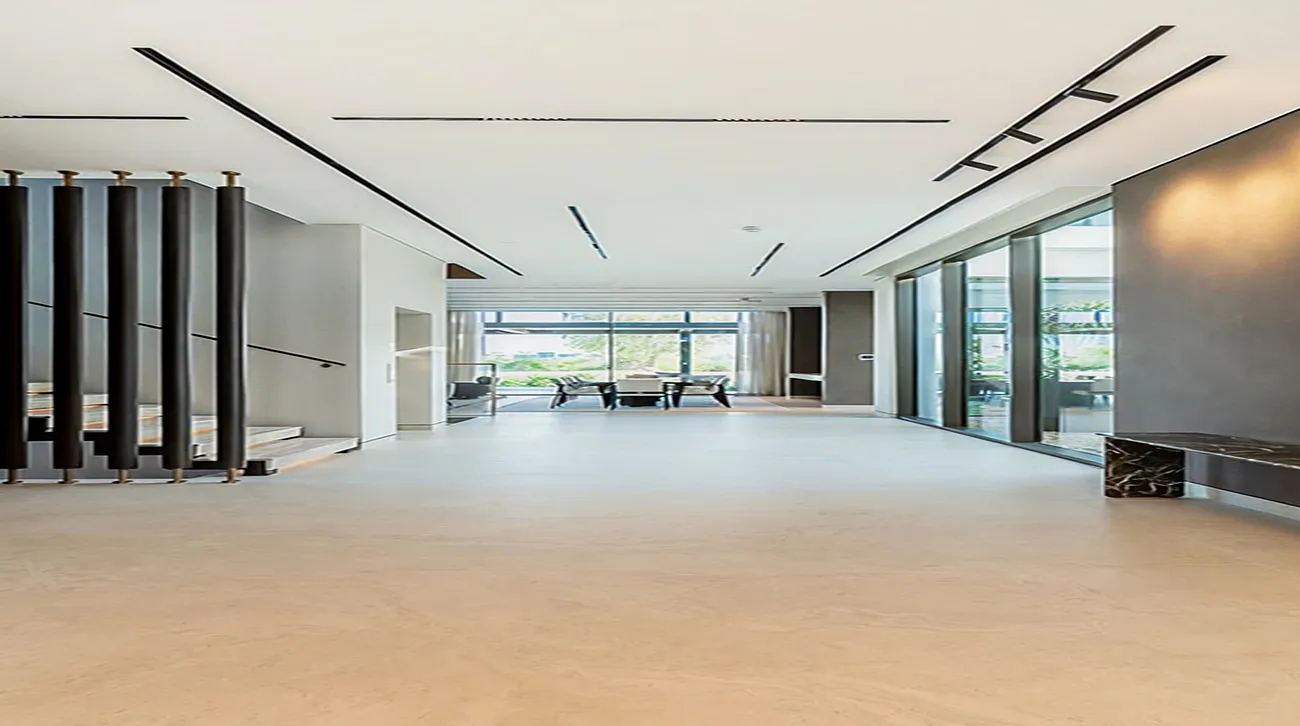Modern interior fit-out with custom ceiling and expansive windows in Dubai Hills.