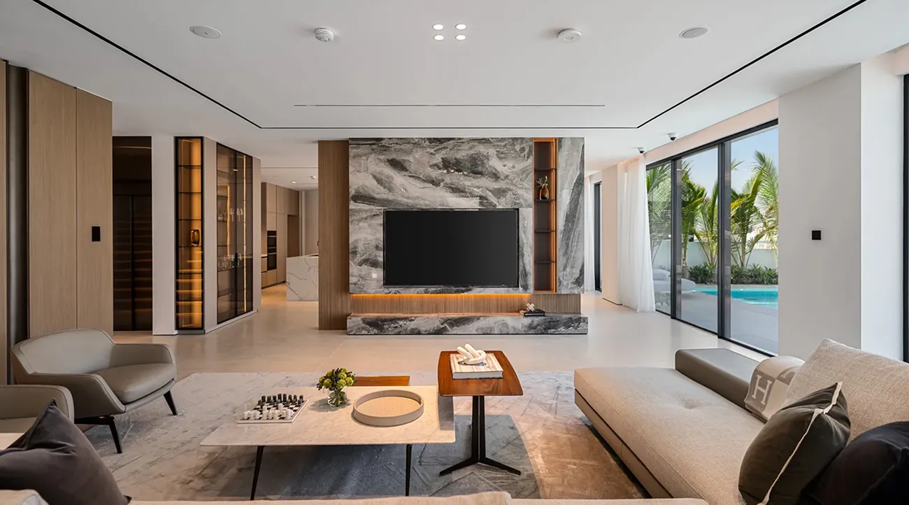 Garden homes renovation in Palm Jumeirah featuring living room interior with integrated media wall and open-plan design