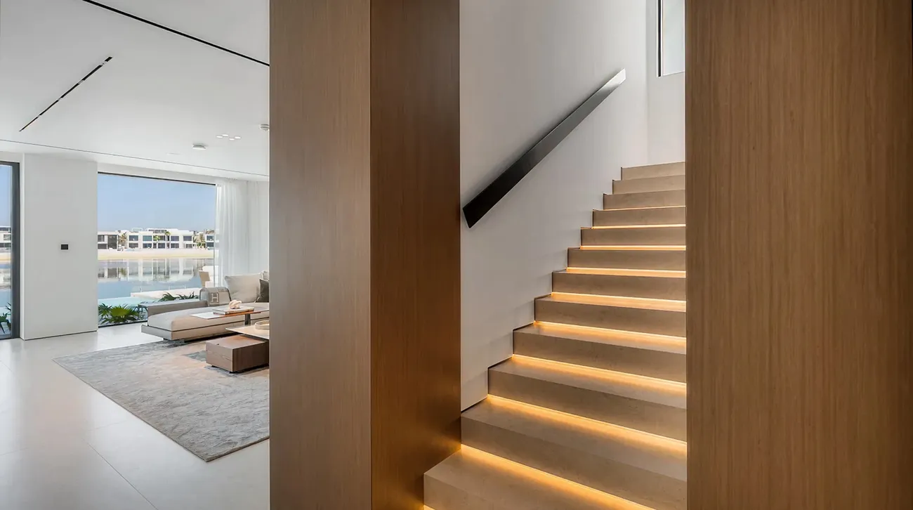 Modern elevator and staircase in renovated villa interior in Palm Jumeirah.