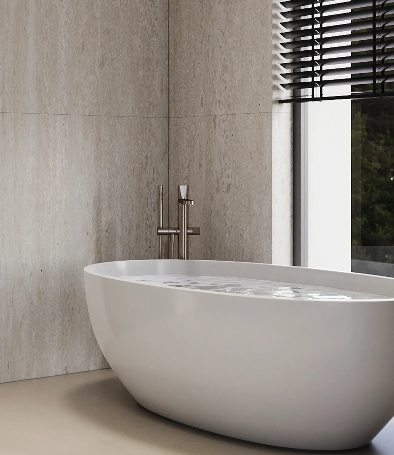Modern bathroom design with a freestanding white oval tub and metal faucet.