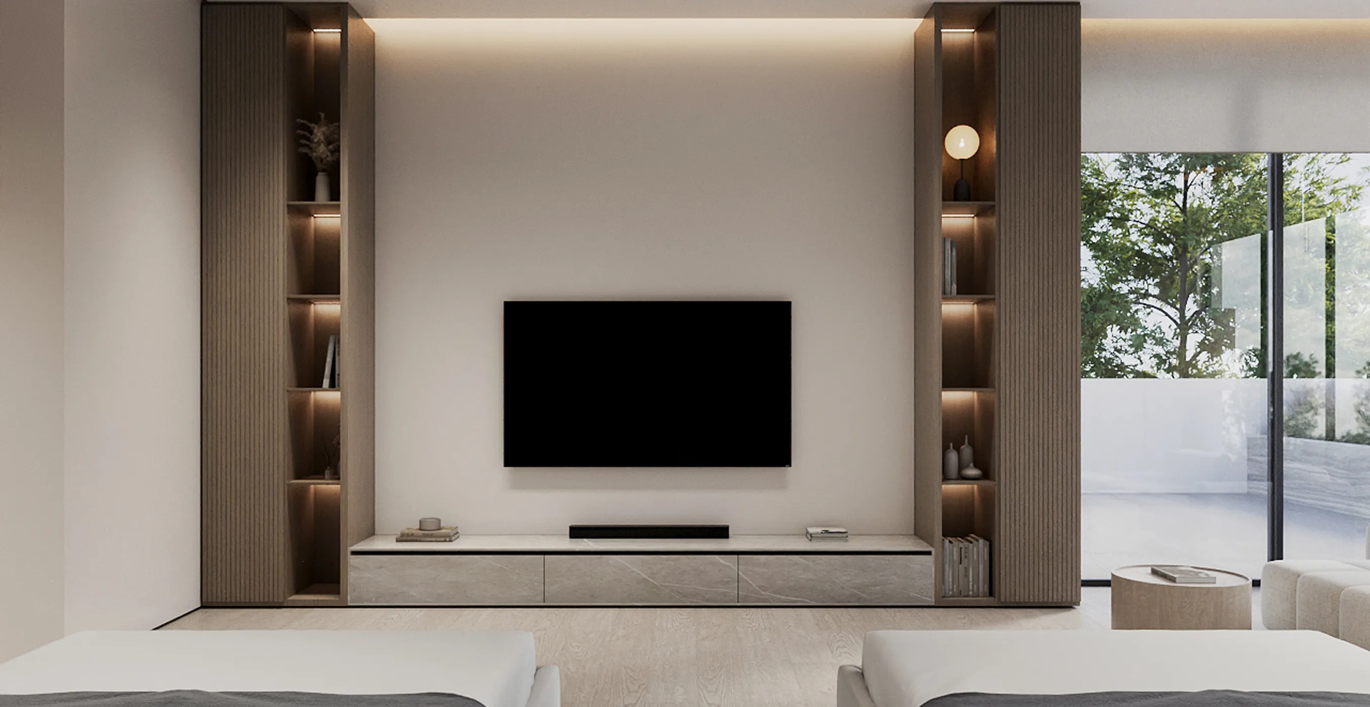 Modern living room interior with wall-mounted TV and built-in lit shelving in a luxury villa.