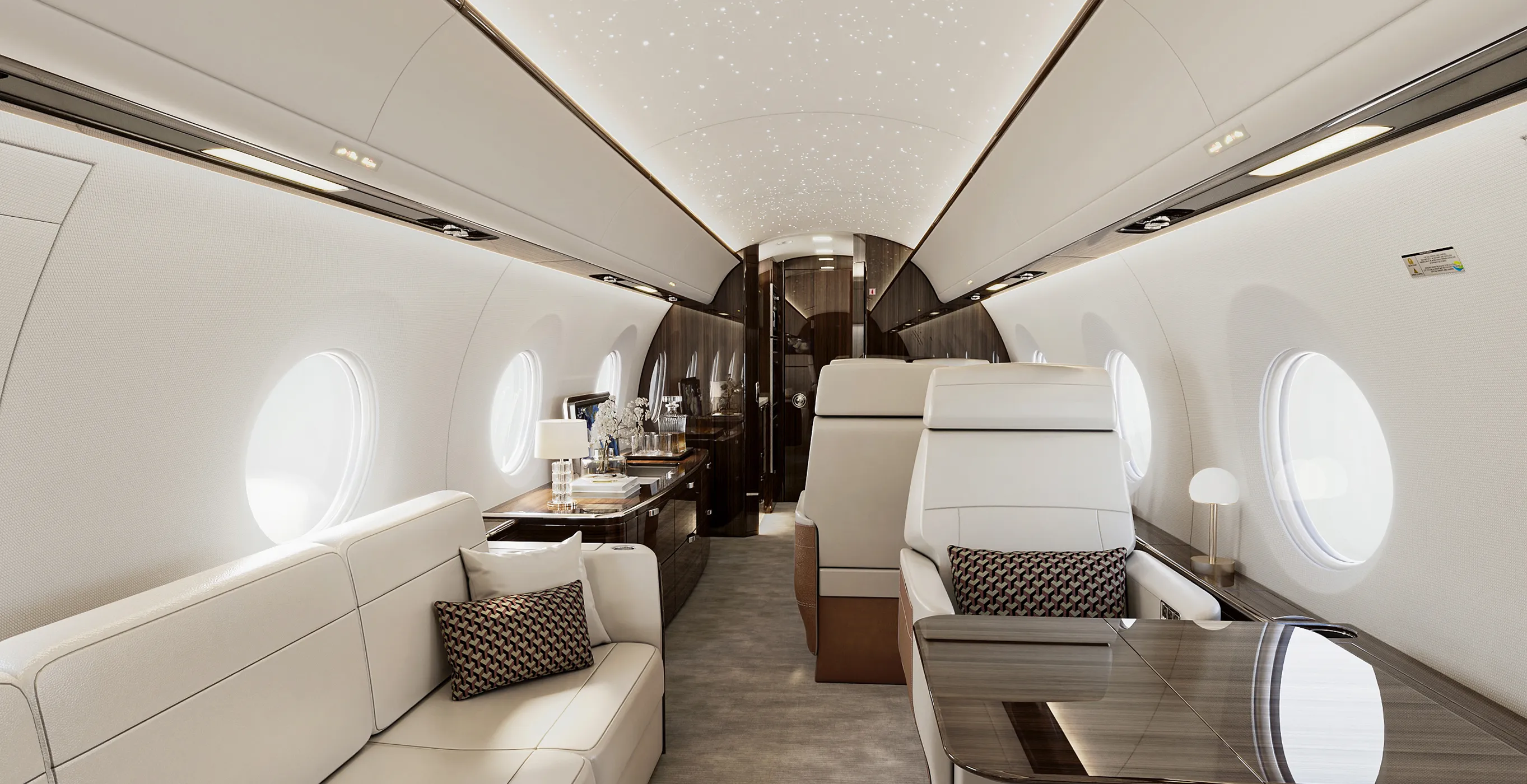 Luxury private jet interior design by Rayfitout with bespoke joinery and handcrafted seating.