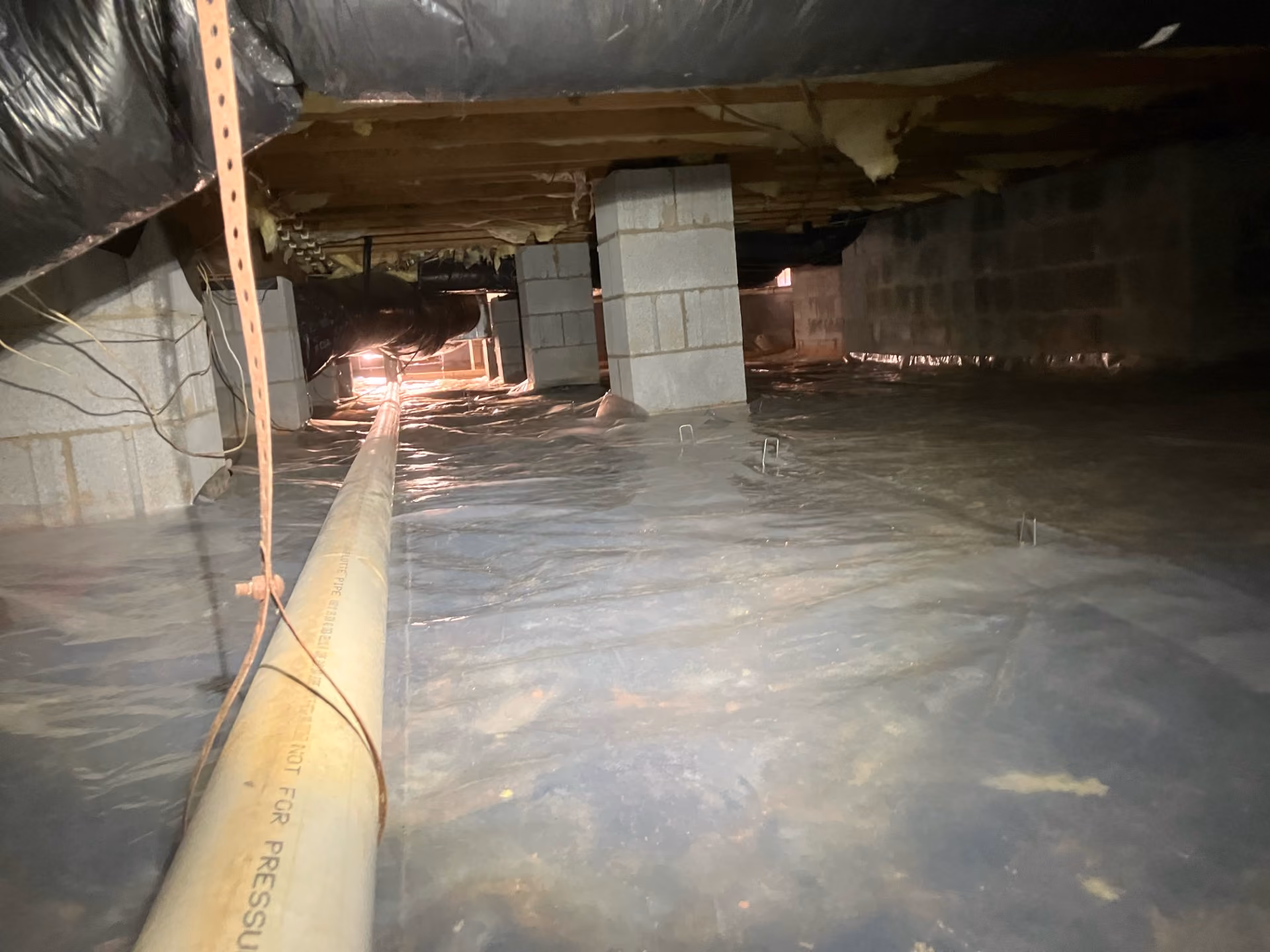 What a Crawlspace Moisture Barrier Does and Why It Matters