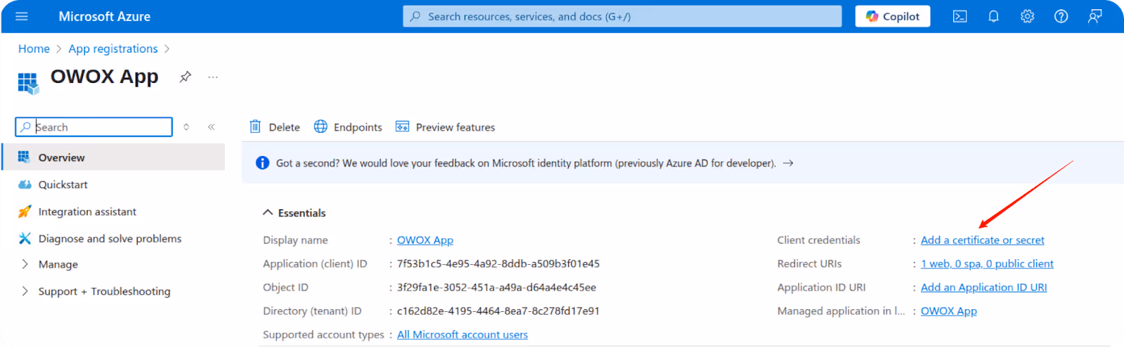 Microsoft Azure App registration page showing OWOX App with an arrow pointing to "Add a certificate or secret" under Client credentials. i-shadow i-radius