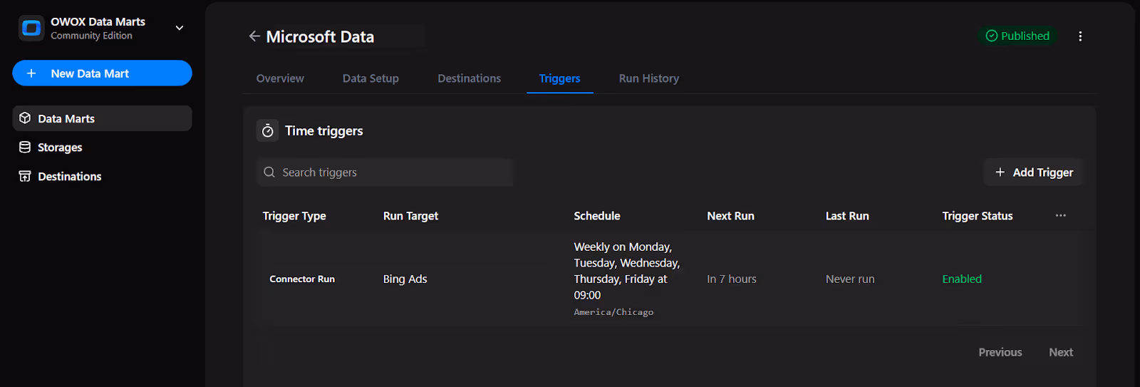 OWOX Data Marts trigger summary screen showing active time trigger details, including schedule, status, and upcoming run for Microsoft Data. i-shadow