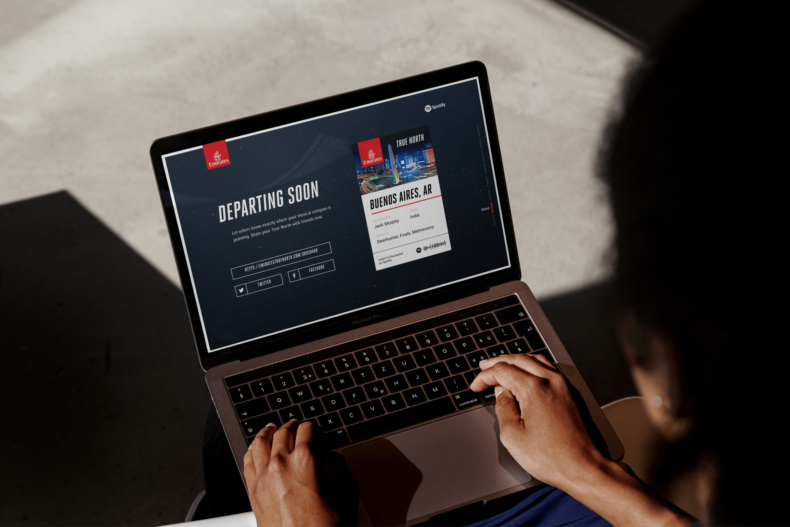 A woman using a laptop showing the Truth North experience open on it.