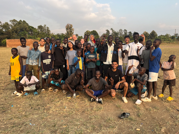 A picture of the team and the boys after football ministry