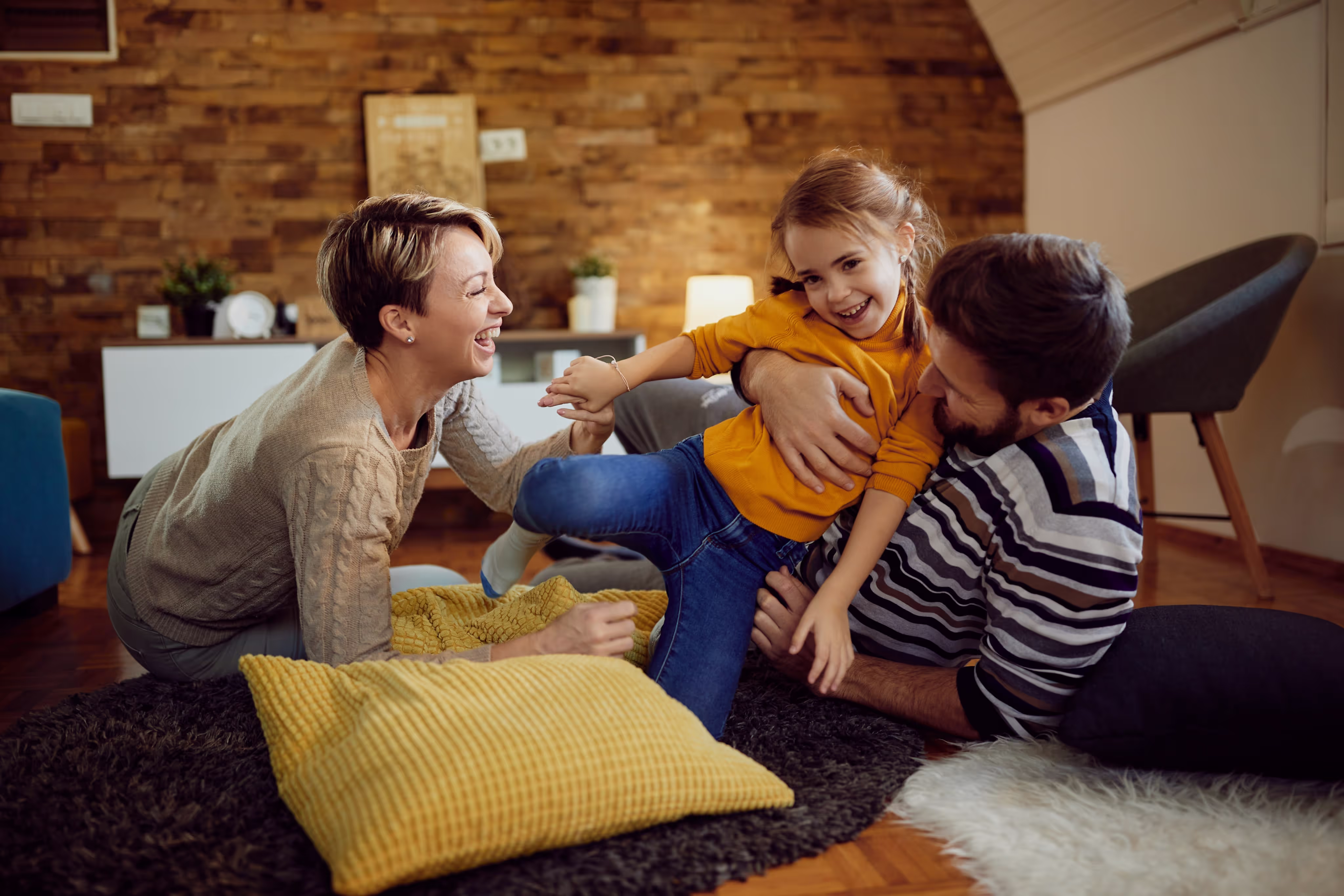 Family relaxing in a cool, air-conditioned luxury living room