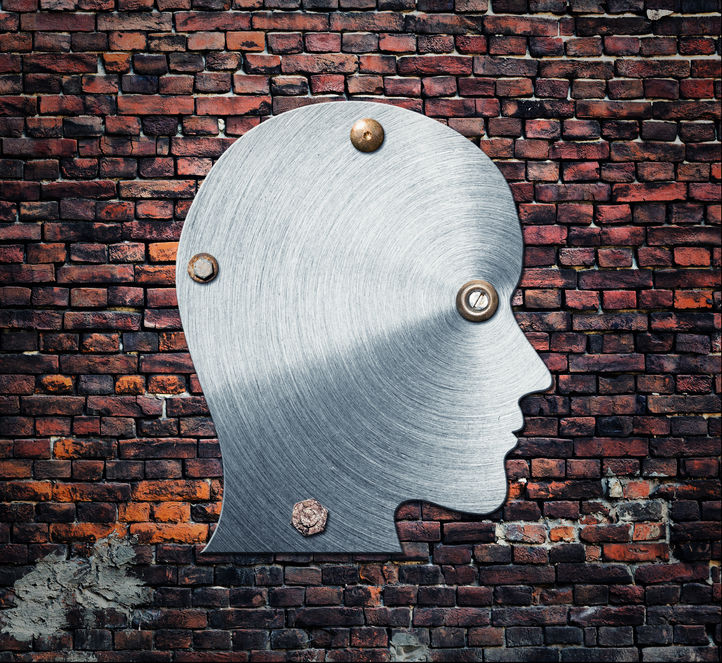 34564520 - one metal silhouette of human head on brick wall