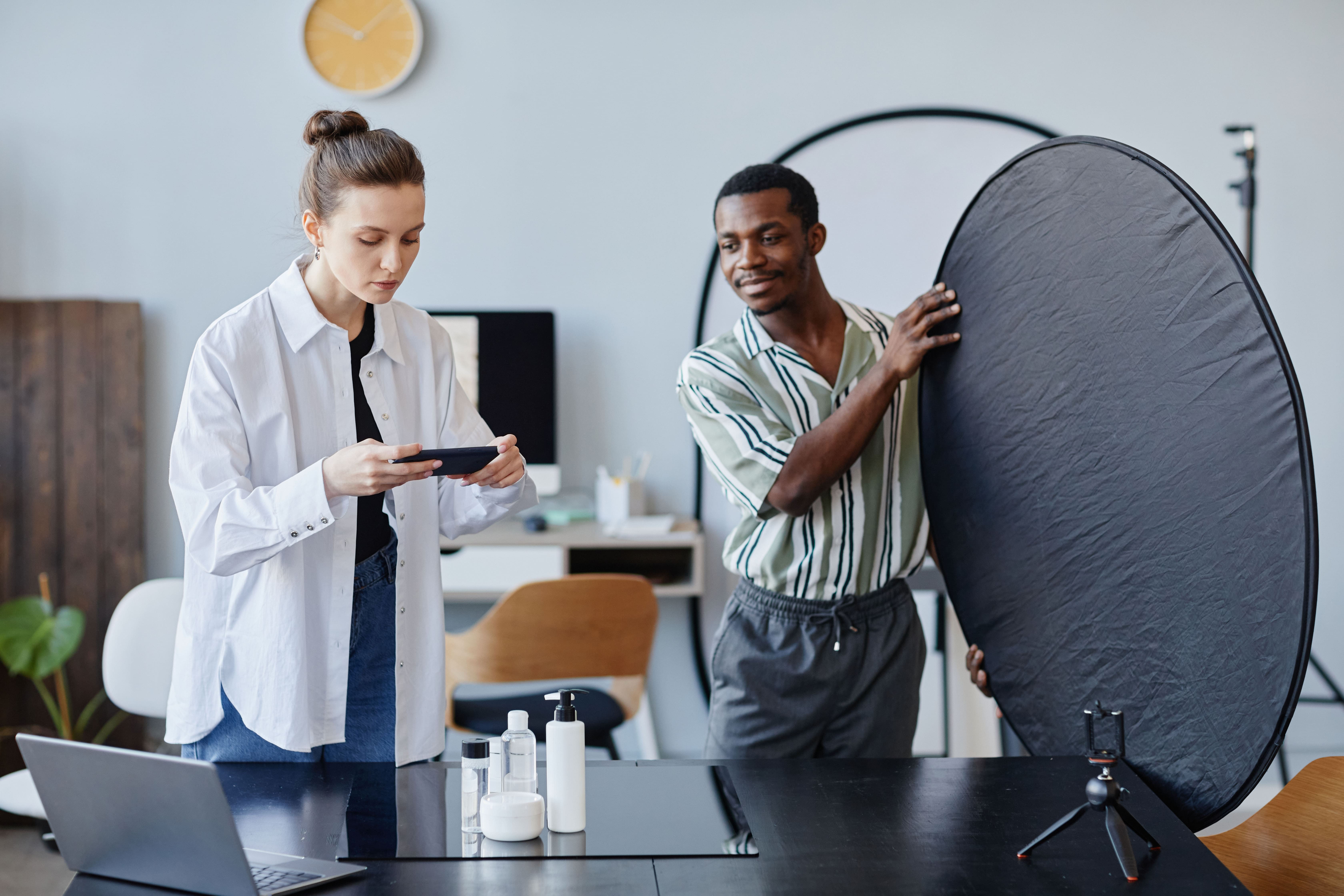 man and woman engage in conversation within a professional office setting.
