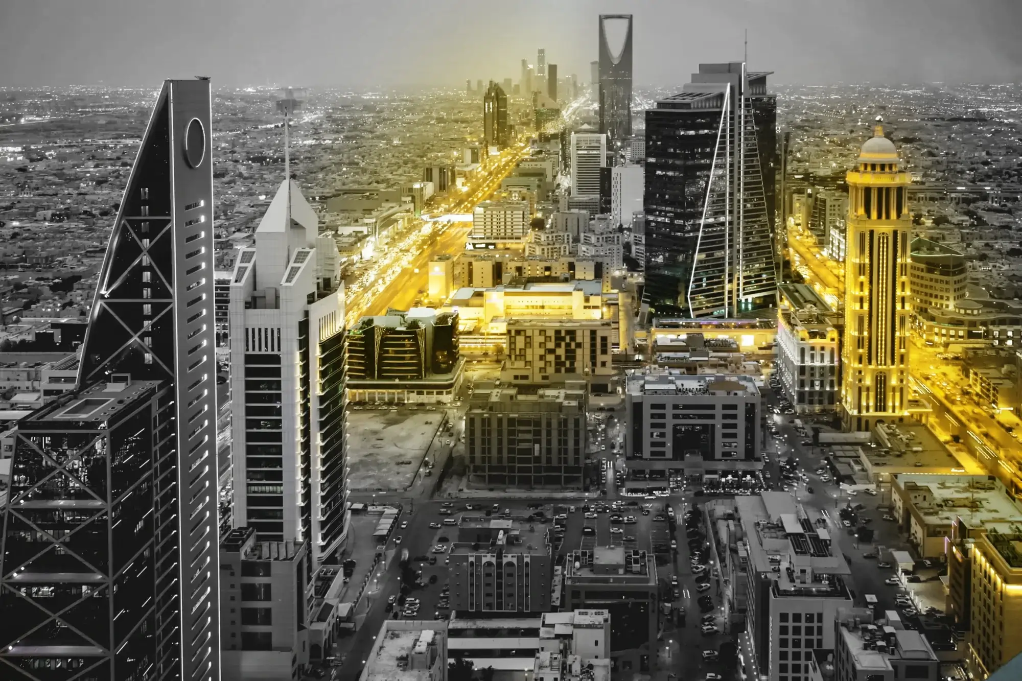 Hard hat, gloves, level, and blueprints on architectural plans.