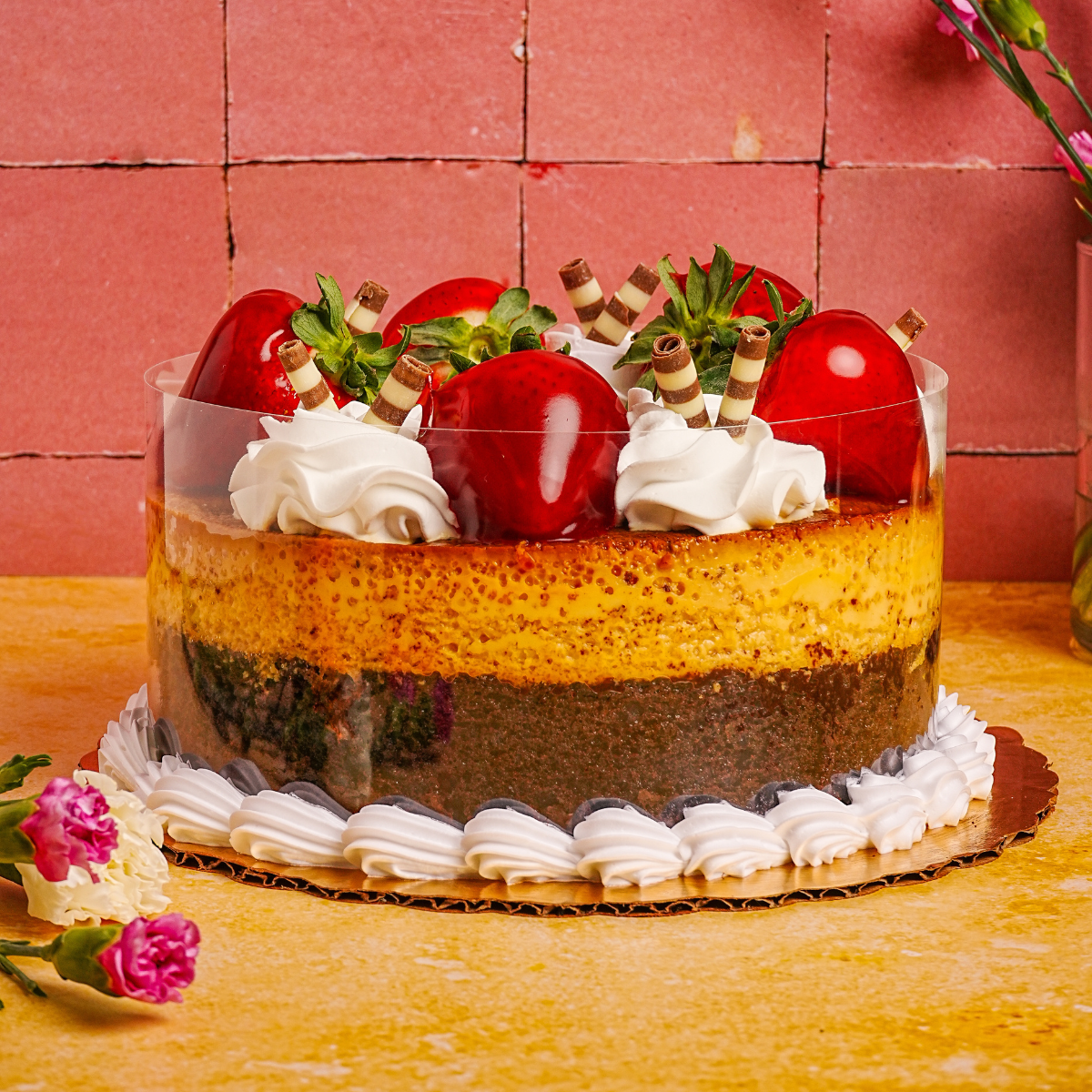 Tray of freshly made guacamole with chips and a cazo of guacamole in the background
