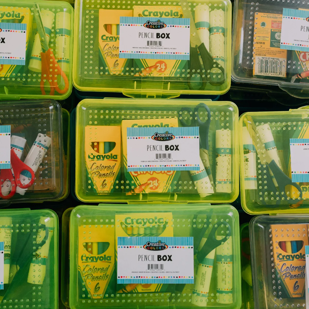 Rows of donated pencil boxes filled with school supplies for the School Store event.