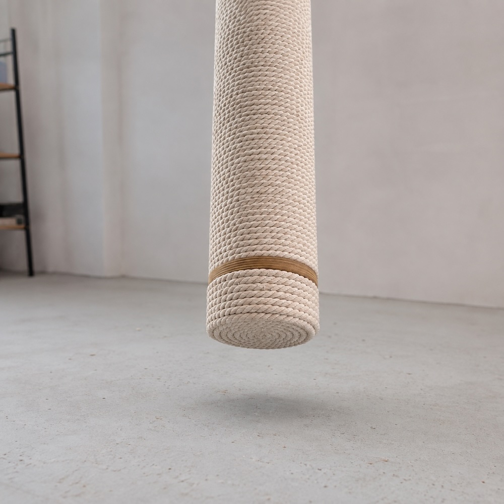 Bottom of a hanging rope scratching post floating above the floor