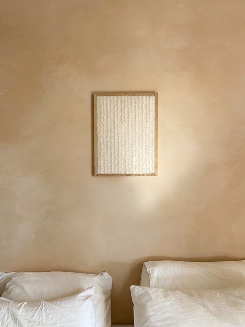 textile wall art in bedroom