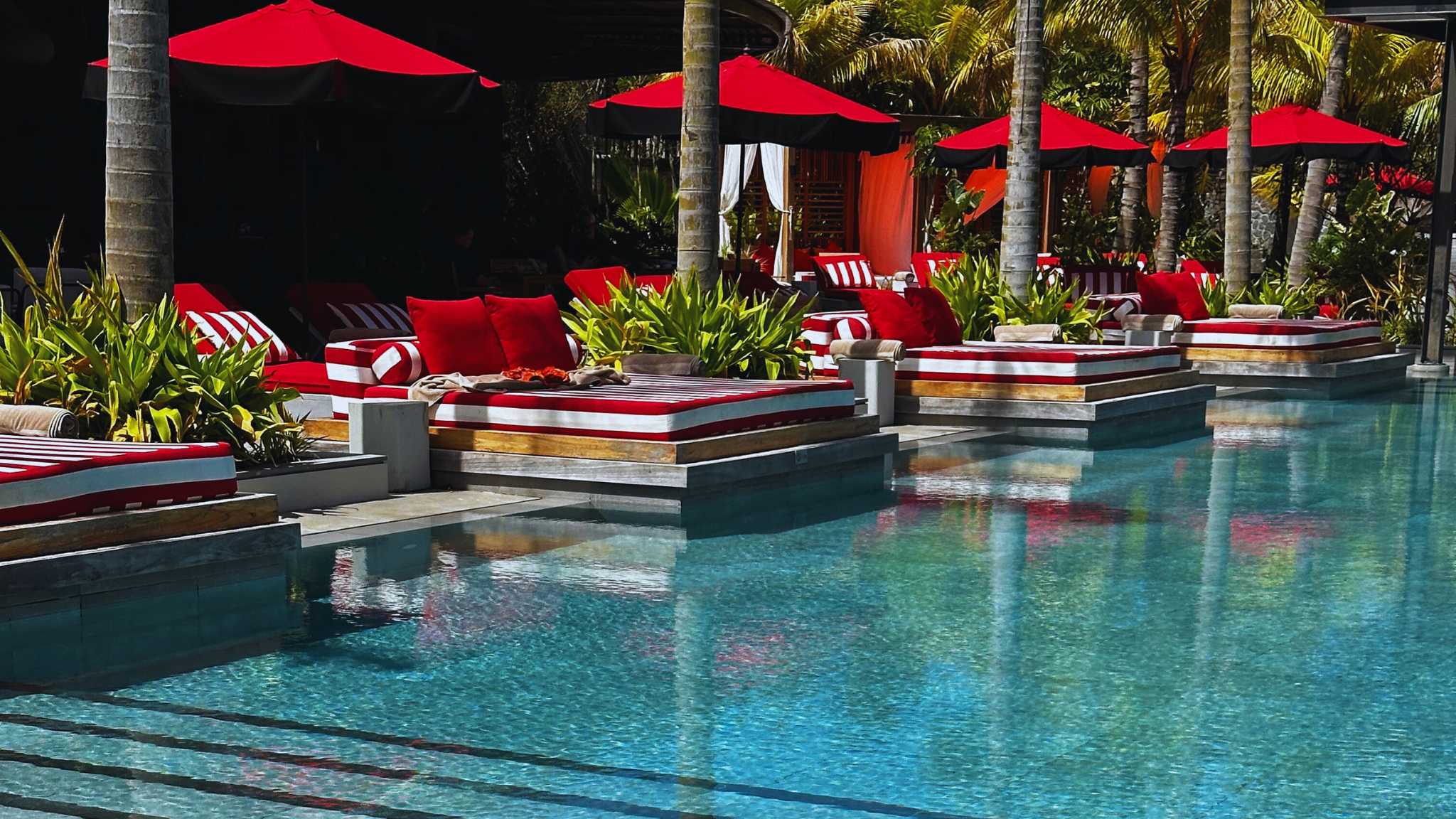 Beach Rouge pool at LUX* Grand Baie Mauritius with beachfront dining and ocean breeze.
