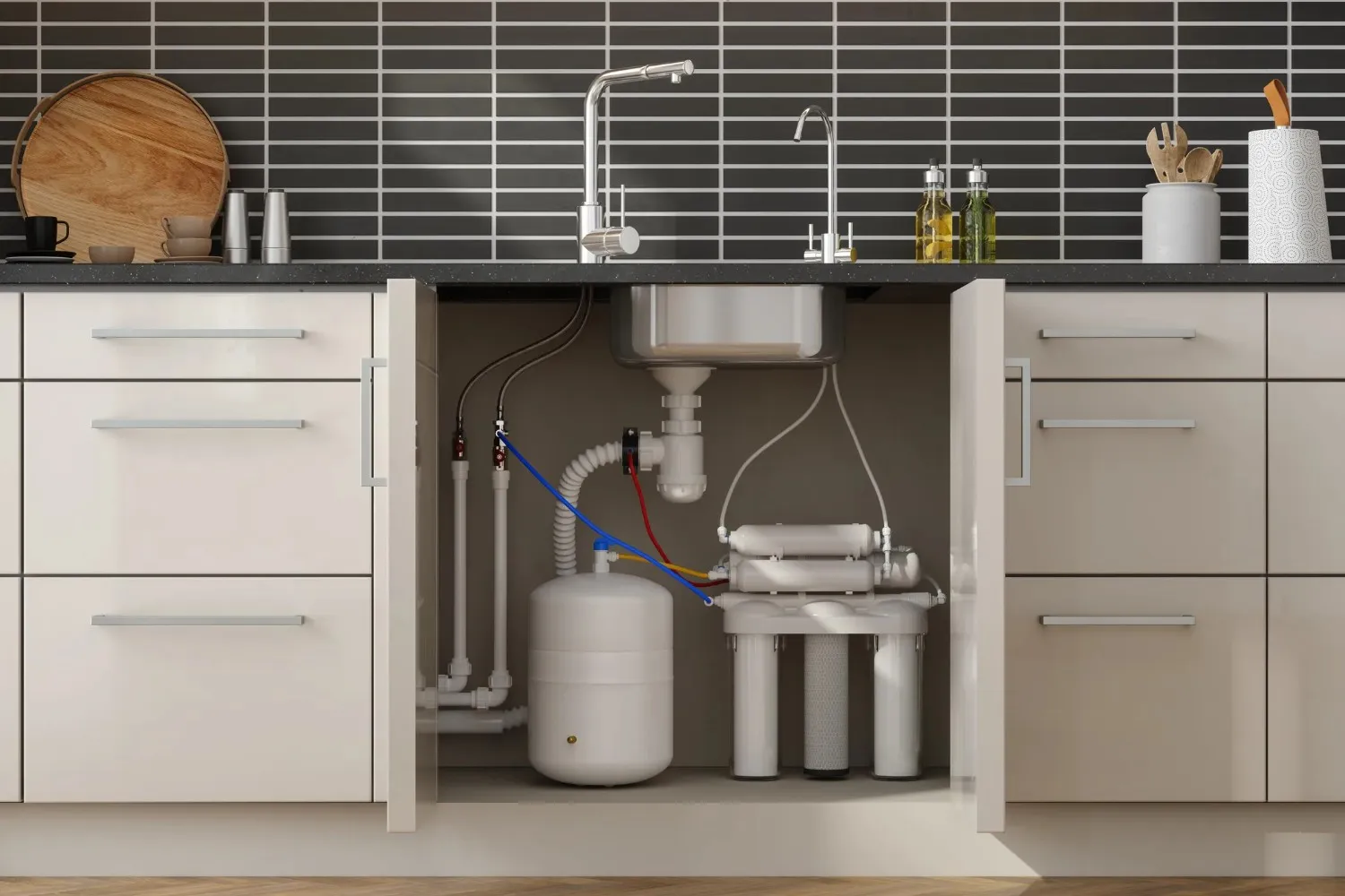 An under-sink reverse osmosis water filtration system with a storage tank and multiple filter cartridges, installed in a modern kitchen cabinet