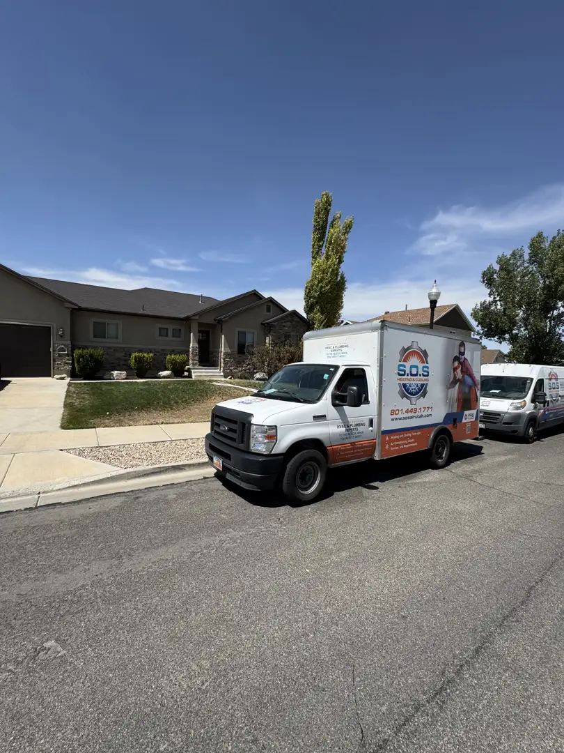 Service vehicle parked in a quiet Murray residential neighborhood during a maintenance call - best water heater repair in