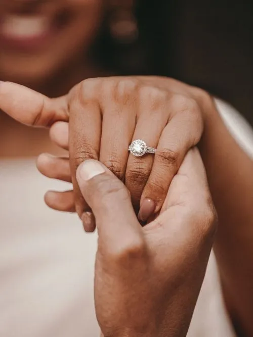 African bride showing her wedding ring to the camera after her wedding ceremony