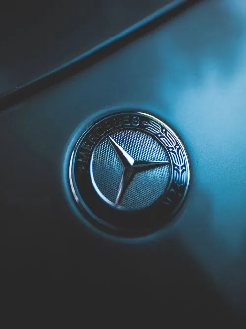 Light creatively cast across a Mercedes Benz car badge in a brand video for marketing