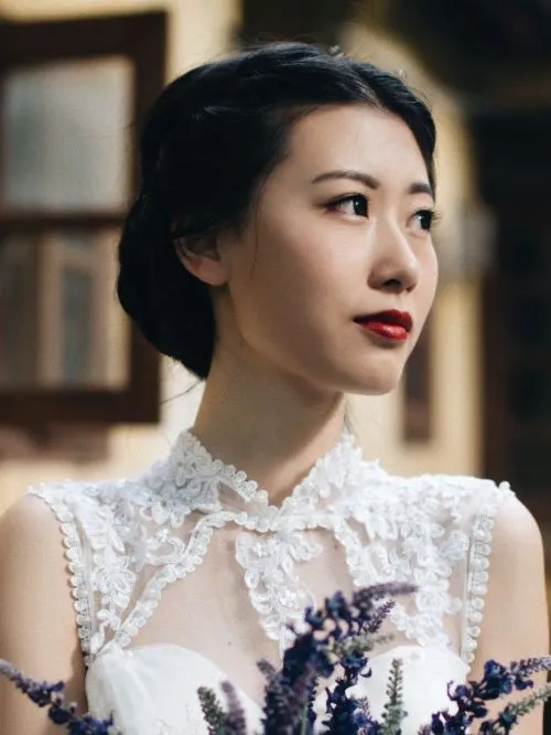 Beautiful Chinese bride in her dress posing for a photo before her wedding