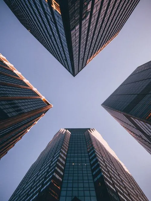 Creative photography of a city commercial district looking up at skyscraper office buildings