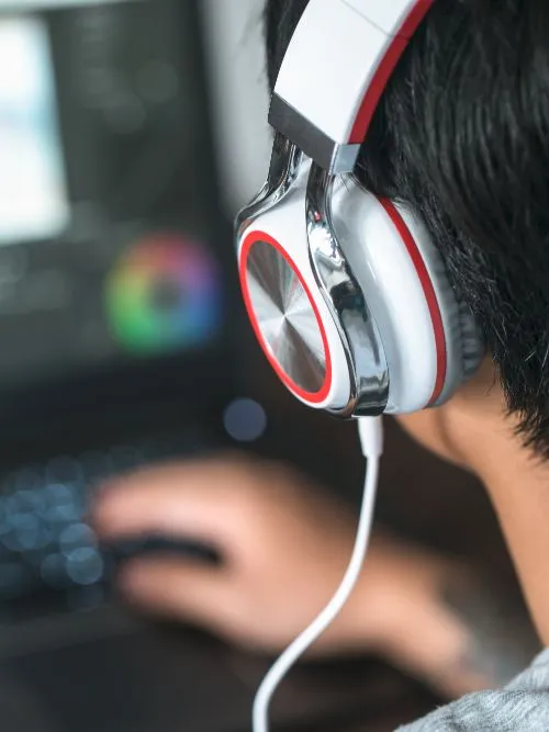 Video editor working on an Apple computer editing footage for a corporate project