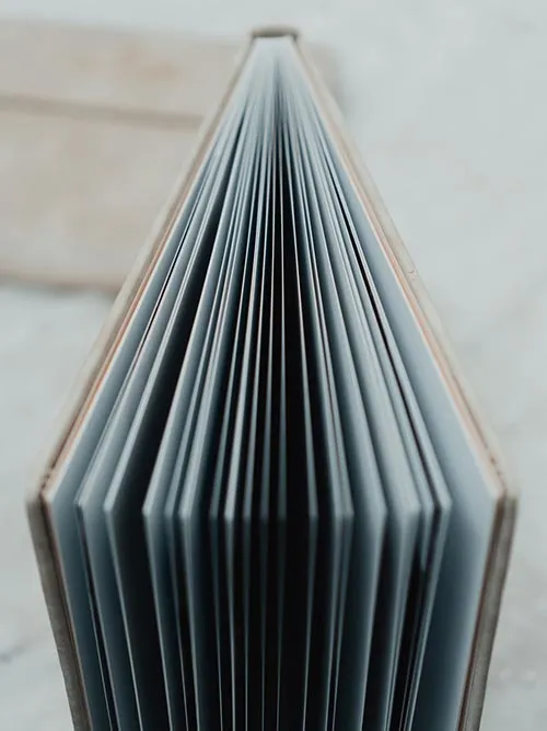 Spine of a photo album showing all the pages designed