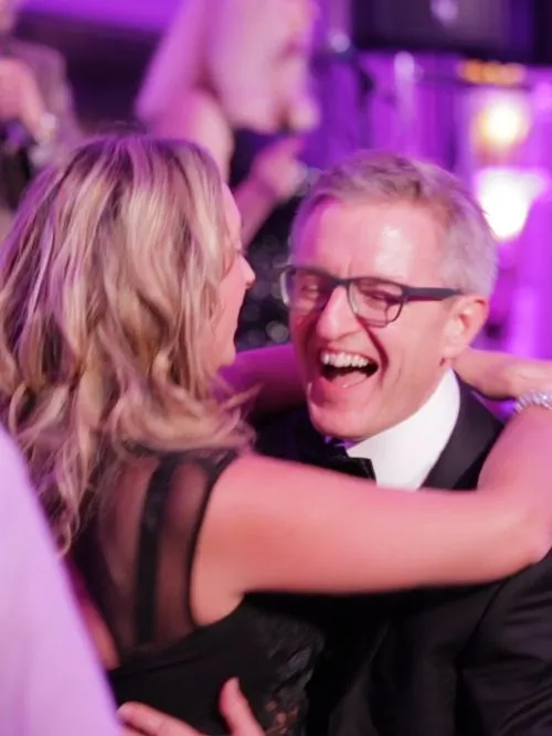Filming of a man dancing and enjoying himself at a party celebration