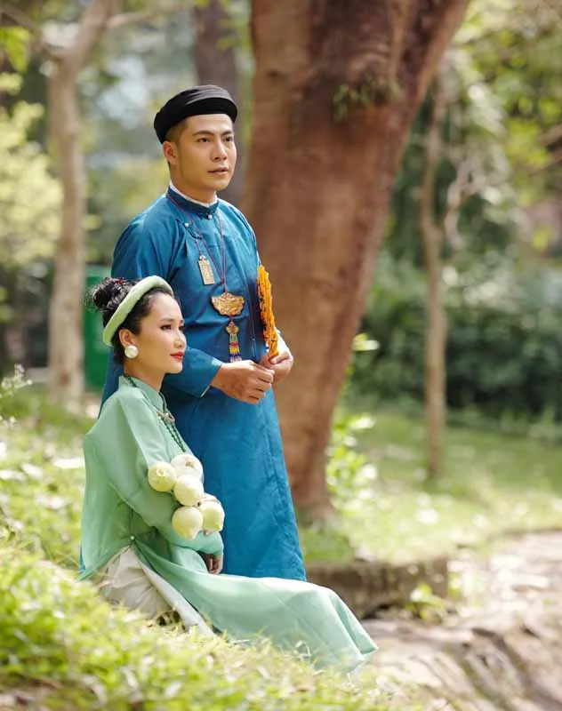 Buddhist couple standing together on their wedding day