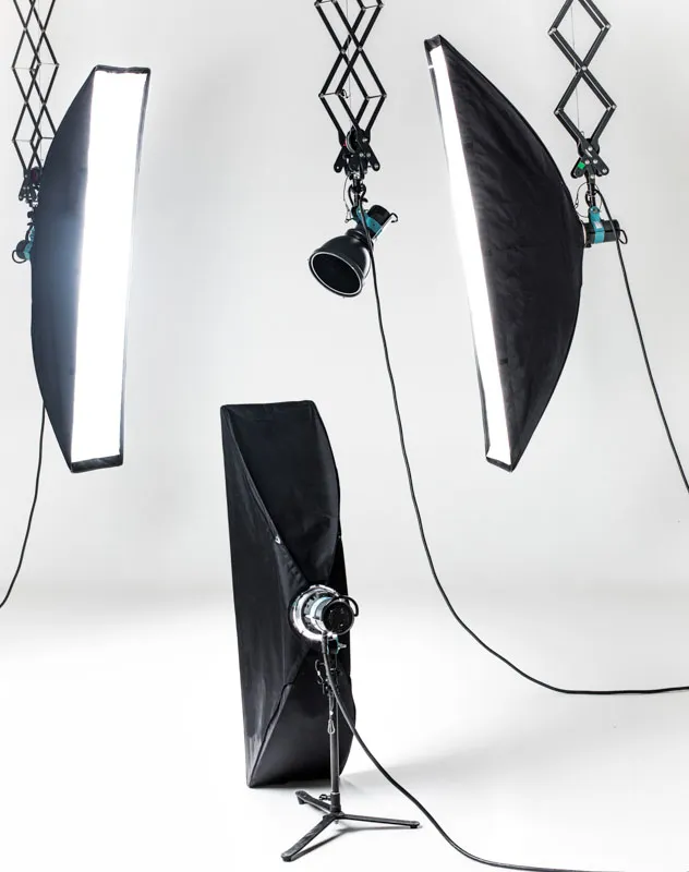 A collection of studio lights against a white background