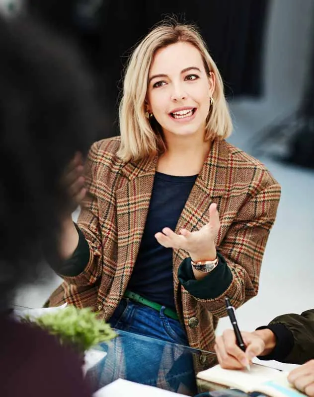 A woman speaking to camera providing a client testimonial