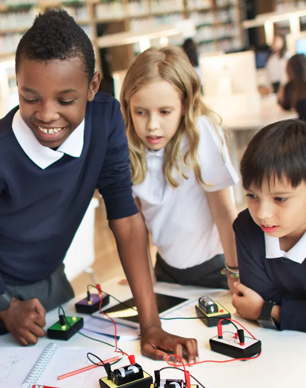 A group of children watching an experiment at school