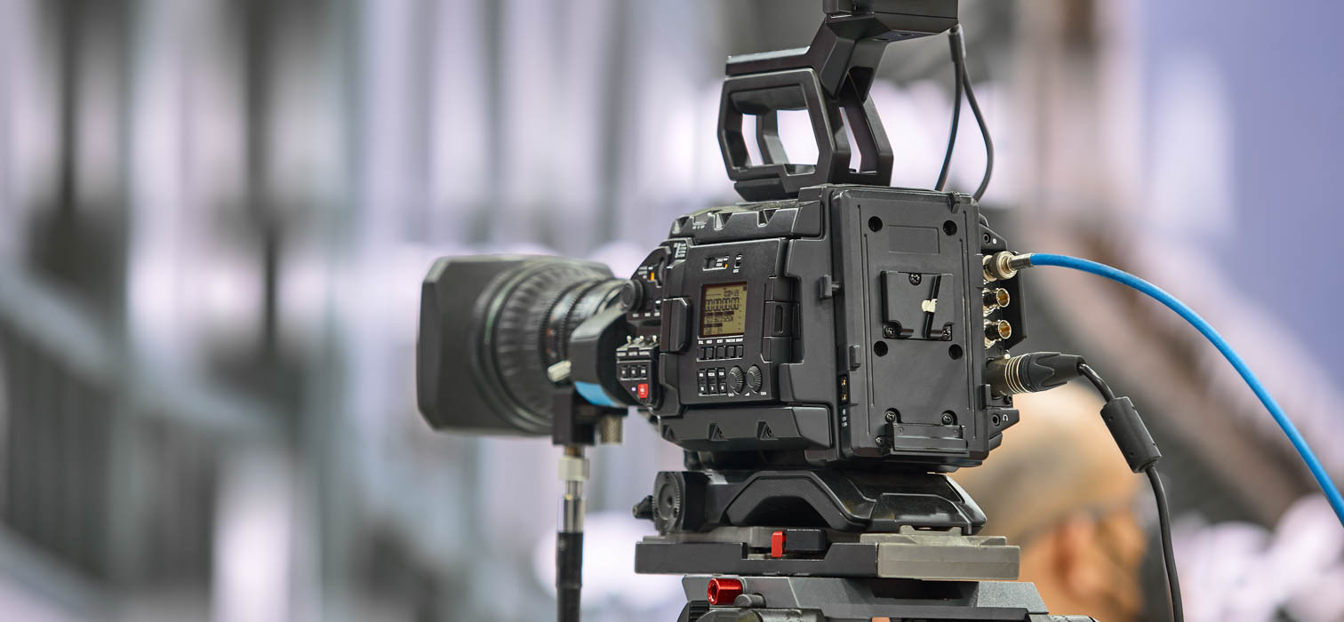 Rear view of a professional Sony video camera being used for livestreaming