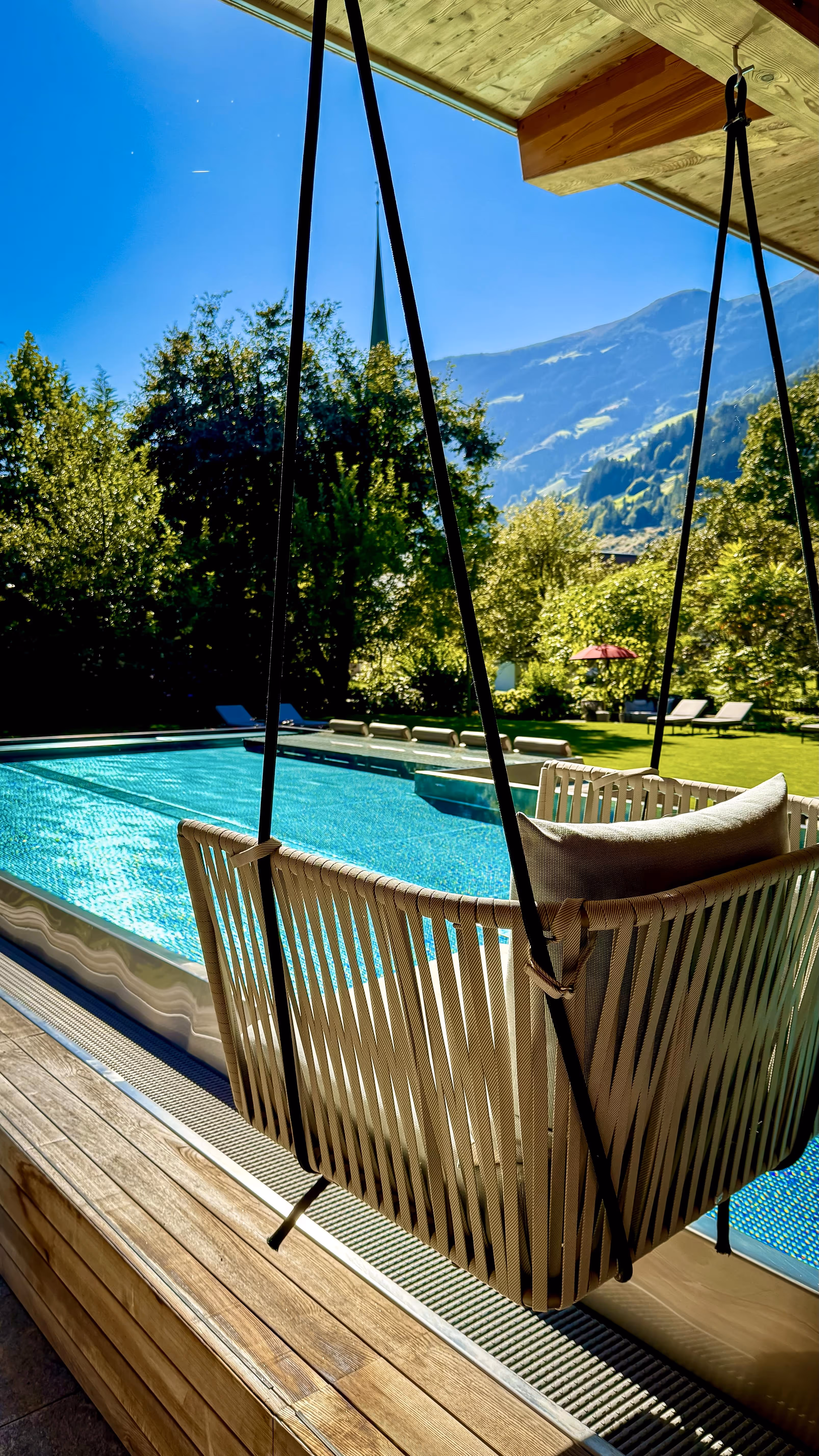 Pool with hanging chair