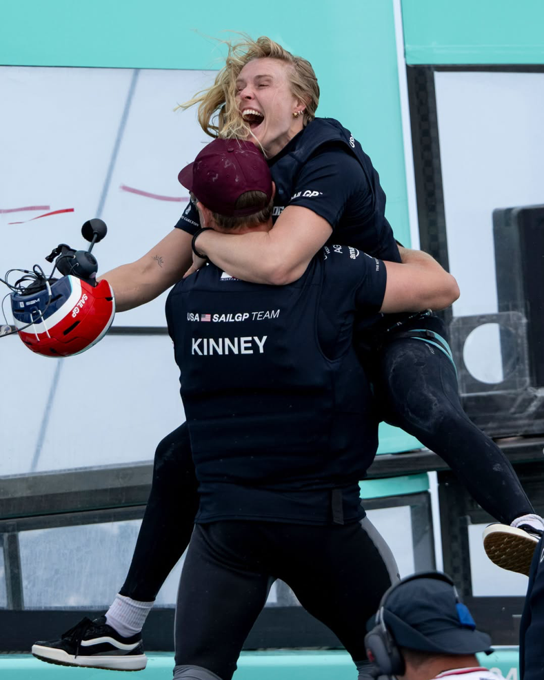 American SailGP grinders Anna Weis and Peter Kinney celebrating victory in Valencia