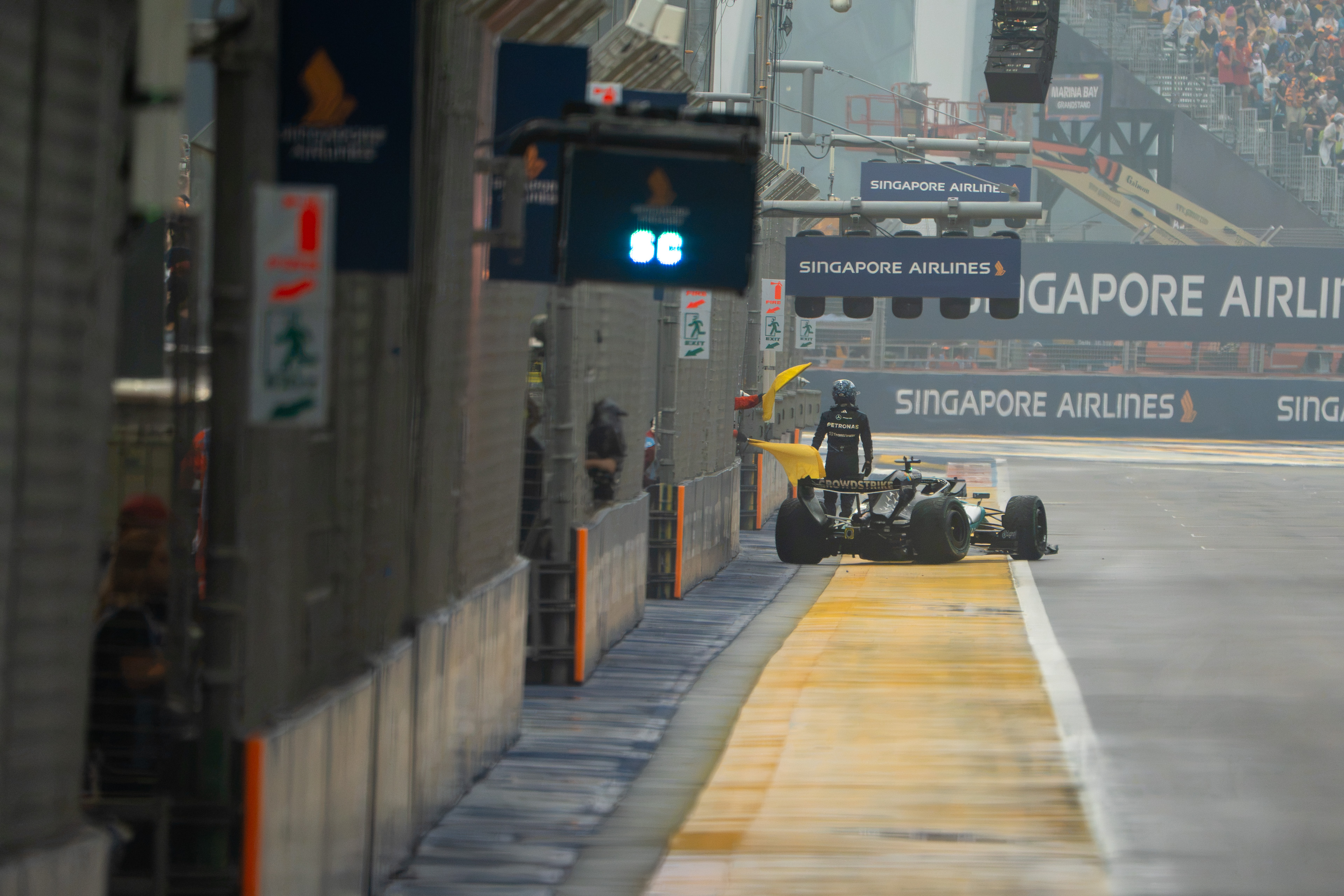 Formula 1 driver George Russell crashing out of the lead of the Singapore Grand Prix sprint in Marina Bay