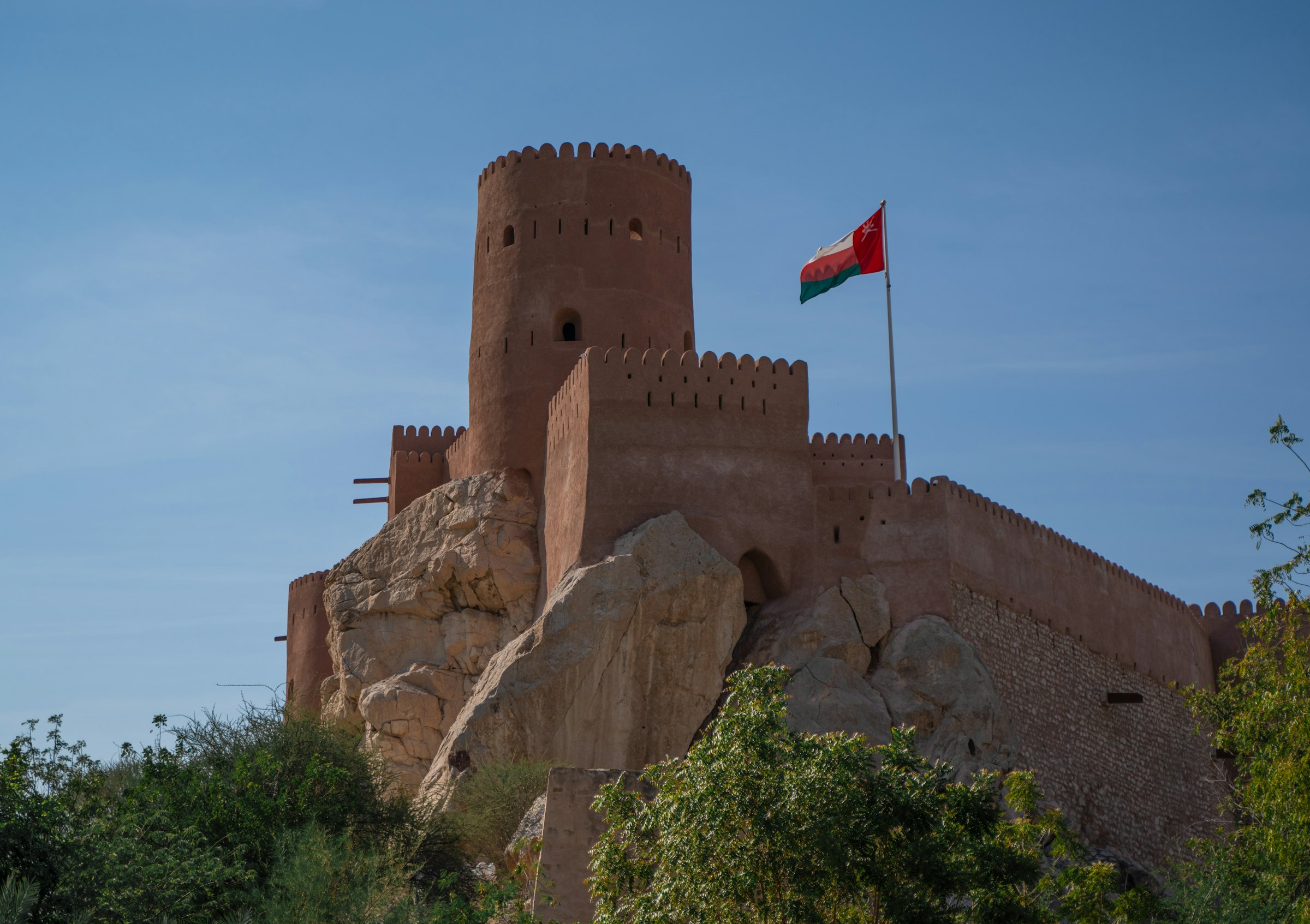 Nizwa Fort standing under a clear sky in Oman