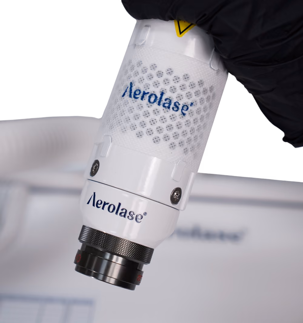 Handing holding the Aerolase Era handpiece with the Hybrid Fractional lens.