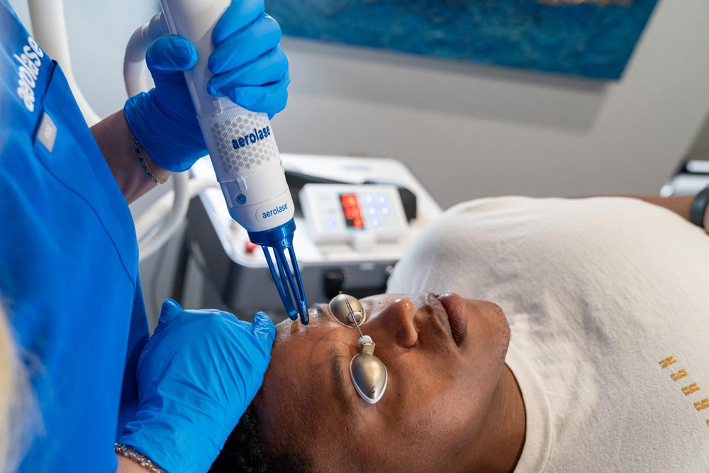 Ashlee Bunkelman, LE treating a Fitzpatrick 5 skin type with the Aerolase Era.