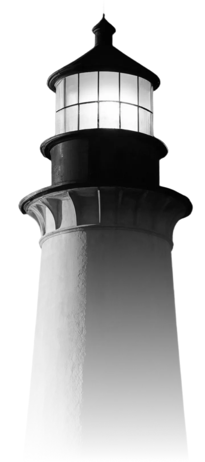 Black and white image of a lighthouse tower with a glowing lantern room at the top.