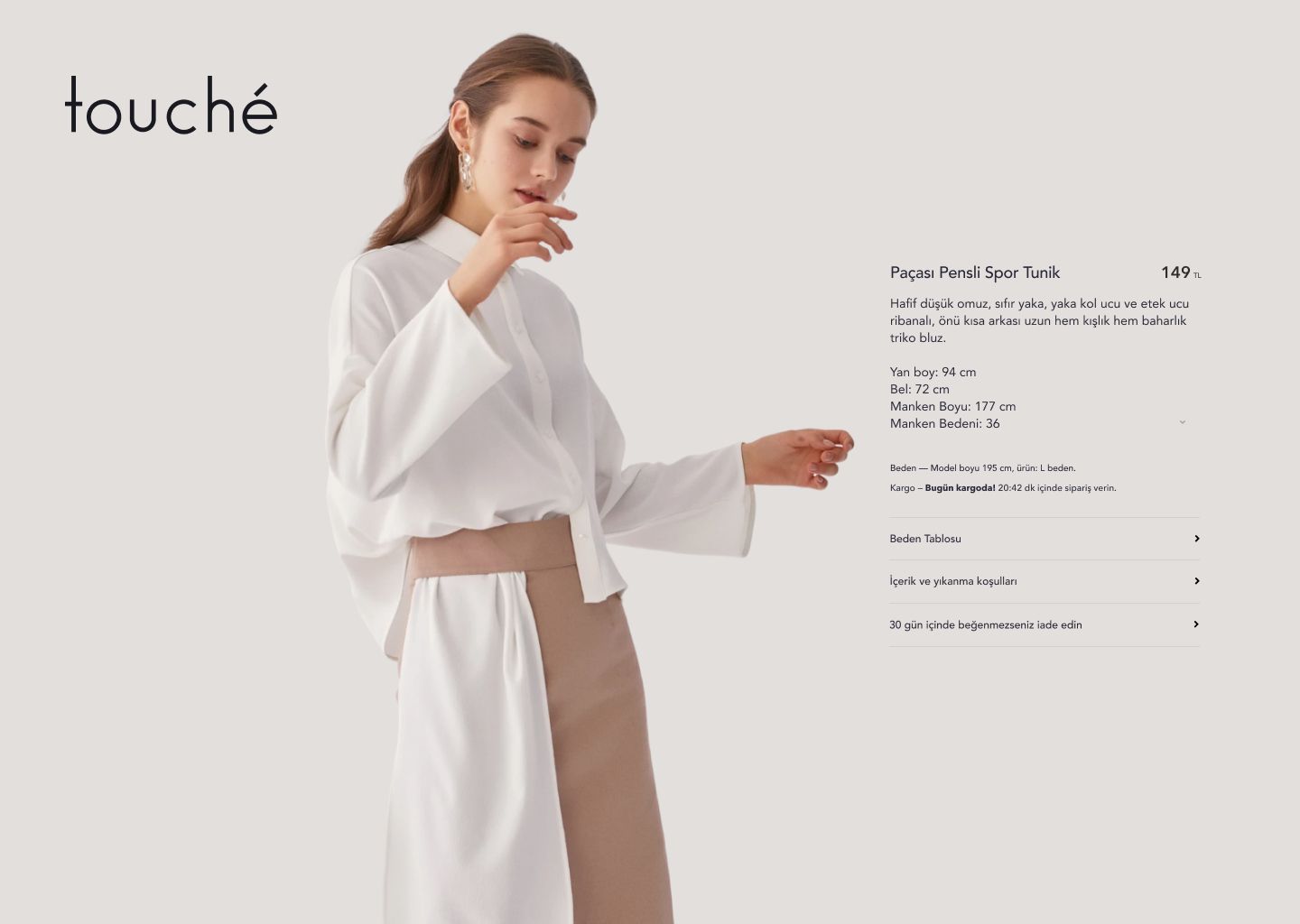 Touché product detail layout for a white tunic with size details