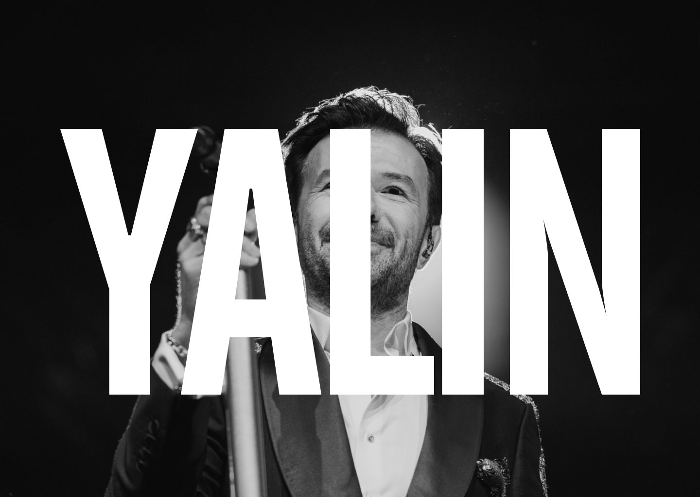 Black-and-white portrait of Yalın on stage behind his name in oversized type