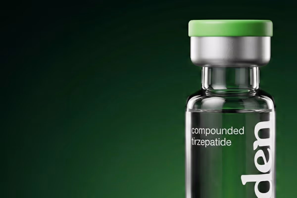 Glass vial with green cap labeled compounded tirzepatide on a dark green background.