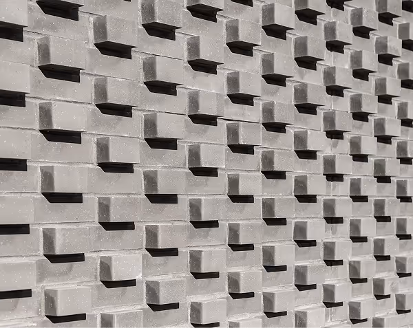 Architectural structure with repeating pattern representing AI website builders vs Webflow comparison